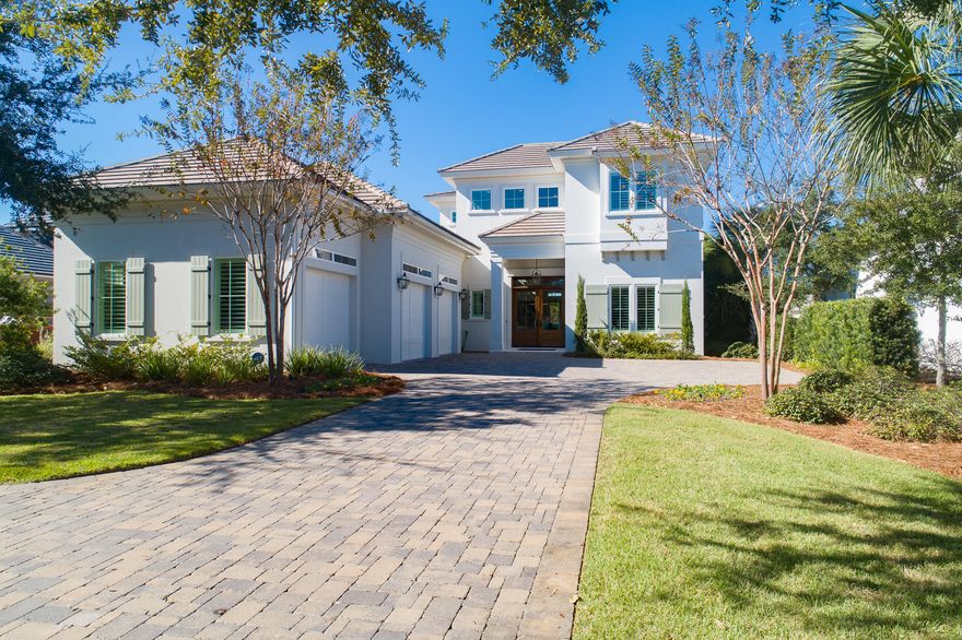 As featured in Coastal Lifestyle Magazine, this stunning 5 bedroom home offers spectacular views of the lake and 13th green on the newly renovated Regatta Bay Golf Course. No detail has been overlooked in the floorplan, finishes & construction of this masterpiece. This home delivers an unforgettable first impression as you enter into the foyer with 2 story ceilings and a spectacular floating staircase. The elegant living room is equally breathtaking with its soaring ceilings, abundant windows, impressive chandelier, fireplace and beautiful bar area. Two sets of double French doors on either side of the fireplace lend a seamless flow for indoor/outdoor living and entertaining. The outdoor oasis with... with heated salt water pool is surrounded with lush landscaping and has lovely golf course and lake views. Enjoy the outdoor kitchen area with both gas and Green Egg grills or relax under the covered lanai in front of the gas fireplace. The chef's kitchen is meant for gathering and entertaining offering high end appliances, custom cabinetry, marble countertops and white washed pecky cypress ceilings and adjacent dining area with a wall of windows and gorgeous glass chandelier. The generous first-floor master suite is beautifully appointed with an exceptional master closet and beautiful marble master bath. The first floor is complete with a large office or guest bedroom and an oversized laundry, connected cleverly to the master closet. Other specialty features of this home include; whole home generator, hurricane rated windows and doors, insulated & hurricane rated garage doors and Fortified Gold Construction Inspection Designation. The Regatta Bay lifestyle offers access to a beautiful golf course, a golf club for dining, tennis courts and a community pool. Take your golf cart to the beach, Destin Commons, or Legendary Marina, where you store your boat.