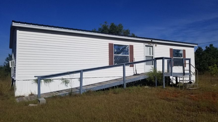 MOTIVATED SELLER! BRING ALL OFFERS! Don't miss this opportunity to own nearly 4 acres of land! It's close enough to Crestview to be convenient, but far enough out to enjoy the country life. There are cedars trees and oak trees throughout, not to mention the grape vines and figs for a great start to your garden. This 2 bedroom 2 bath needs some work, but with a little TLC could be a beautiful place to live and enjoy the country life. Call today to set up your appointment to view it!