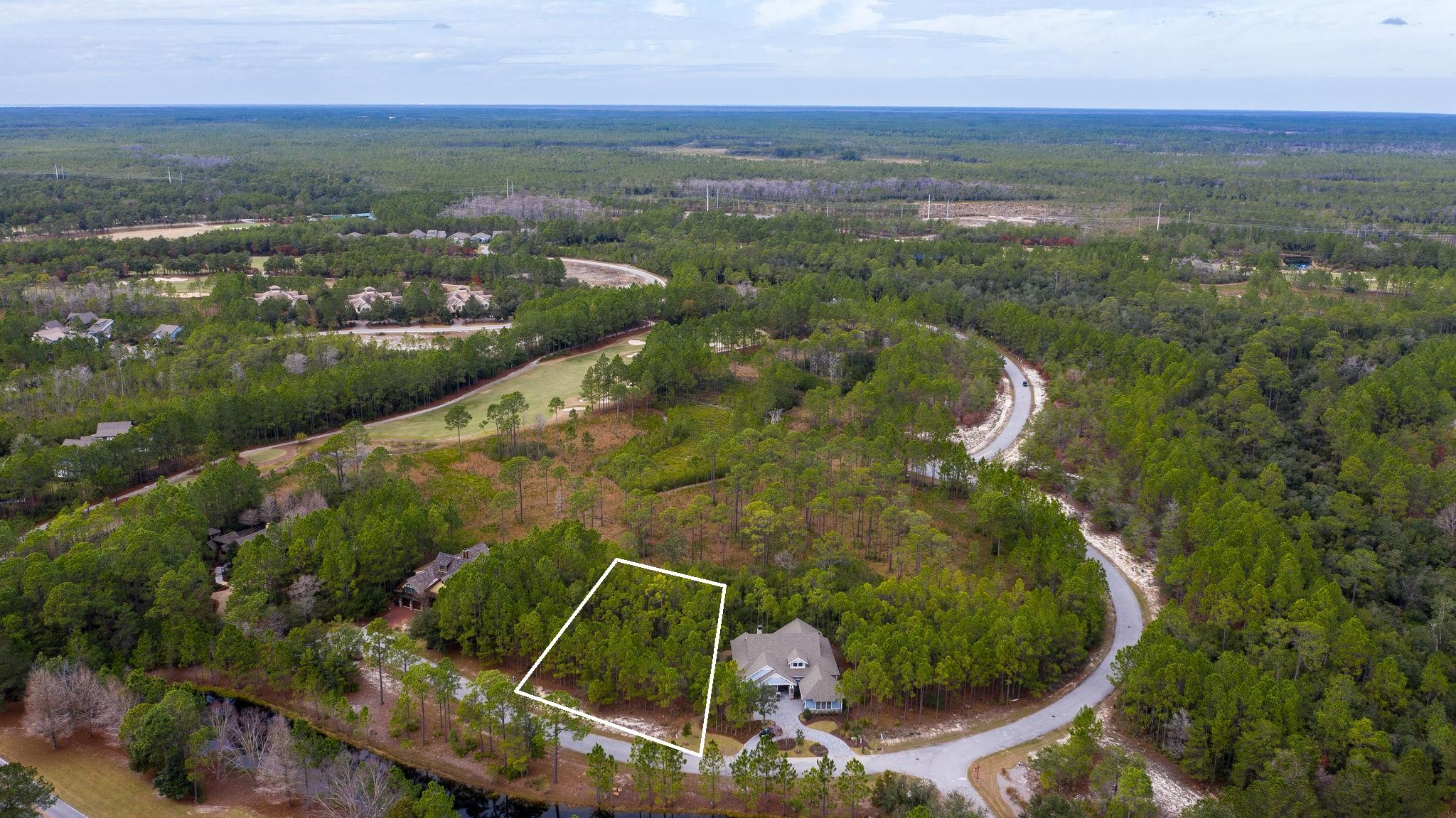 A fantastic value on this home site in the beautiful gated community of Wild Heron. This ''Type B'' lot comes with a set of preliminary house plans and is located on Sweet Bay Trail. It's tucked back from the main street but looks out over the neighborhood and backs up to one of Wild Heron's protected conservation areas. Golf course views of #8 of the Greg Norman designed Sharks Tooth coarse are a possibility. Lot dimensions are 103x150x74x141 and is in Flood Zone X. Come and experience the world class amenities that this lake front coastal craftsman community has to offer, including a fitness center, pool and hot tub, boat house for storing kayaks and paddle boards, dock, community fire pit and gathering area with fireplace all overlooking Lake Powell,