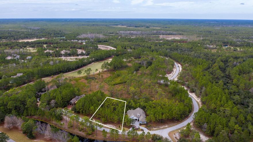 A fantastic value on this home site in the beautiful gated community of Wild Heron. This ''Type B'' lot comes with a set of preliminary house plans and is located on Sweet Bay Trail. It's tucked back from the main street but looks out over the neighborhood and backs up to one of Wild Heron's protected conservation areas. Golf course views of #8 of the Greg Norman designed Sharks Tooth coarse are a possibility. Lot dimensions are 103x150x74x141 and is in Flood Zone X. Come and experience the world class amenities that this lake front coastal craftsman community has to offer, including a fitness center, pool and hot tub, boat house for storing kayaks and paddle boards, dock, community fire pit and gathering area with fireplace all overlooking Lake Powell,
