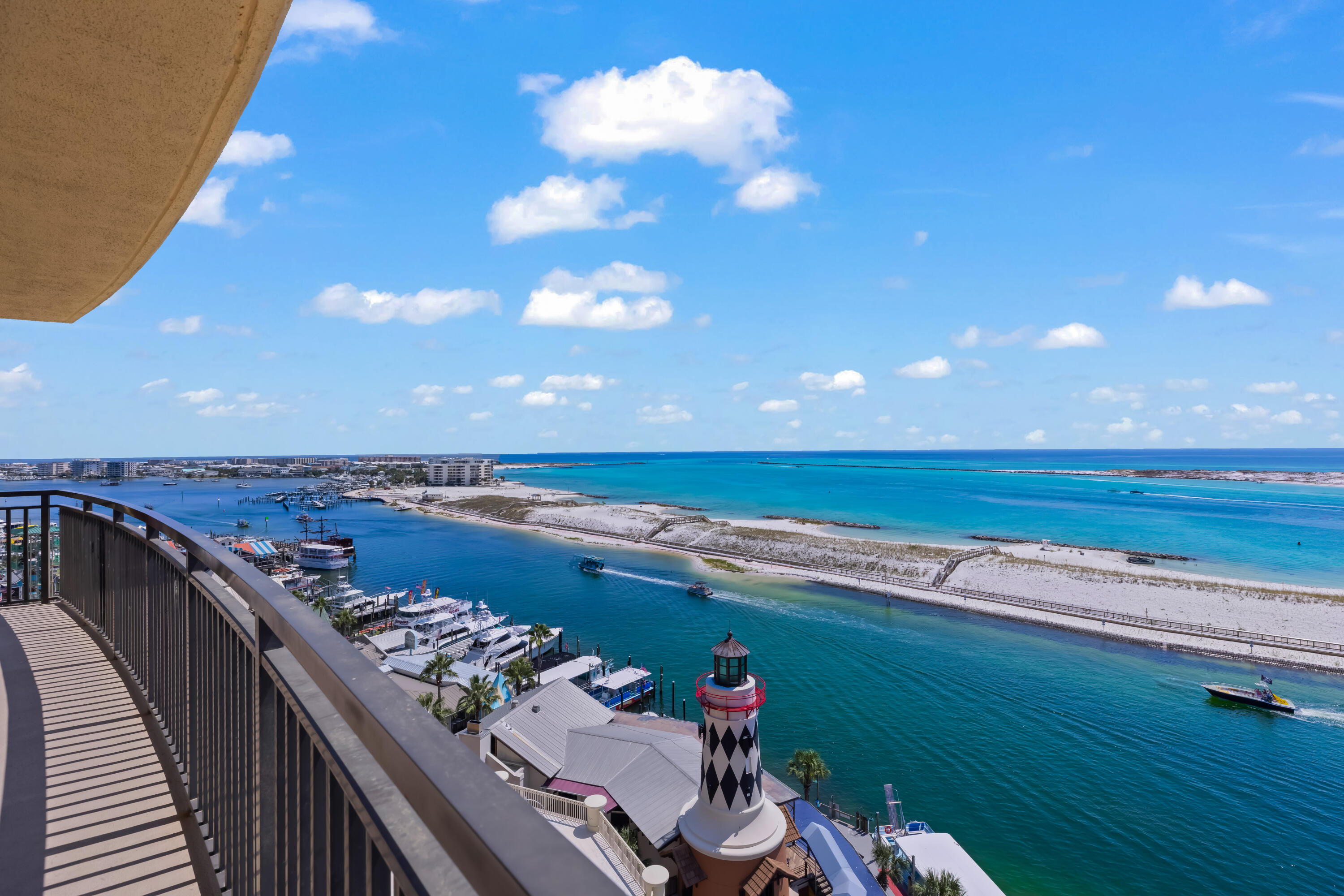 Experience breathtaking views from Unit W625 at Emerald Grande, a beautifully updated 3BR/3BA condo in the heart of HarborWalk Village. Spanning 1,739 sq ft, this fully furnished residence features an open kitchen with premium appliances, spacious living/dining areas, and a luxurious primary suite with spa bath. The oversized wraparound balcony (over 600 sq ft) offers unmatched panoramas of the Gulf, Harbor, and Crab Island. Resort amenities include outdoor & indoor pools, spa, fitness center, sauna, and covered parking garage. Proven rental history makes this a perfect investment or private retreat. Enjoy walkable access to dining, shopping, and entertainment--Destin's premier lifestyle awaits at 10 Harbor Blvd W625. *Buyer to verify all info/dimensions provided herein.