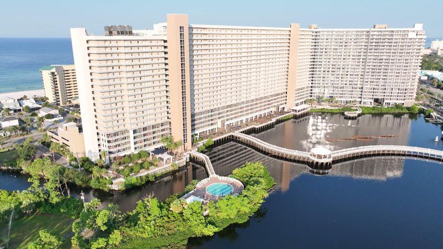 Laketown Wharf #431, a beautifully furnished 3-bedroom, 2-bath condo with breathtaking views and a prime location in the heart of Panama City Beach. From your private, lake-facing balcony, you can enjoy many quiet times. This spacious condo comes with new stainless steel appliances and is fully furnished and turnkey ready, making it ideal as a second home, vacation getaway, or investment property. All you need to bring are your sandals and sunscreen! Laketown Wharf offers resort-style amenities, including three sparkling pools, a full fitness center, a coffee bar, and several onsite restaurants. Just across the street from iconic Pineapple Willy's, you're also surrounded by premier dining, golf, shopping, entertainment, and family-friendly attractions. Don't miss your chance to own a piece of paradise. Come see #431 todayyour beach life starts now!