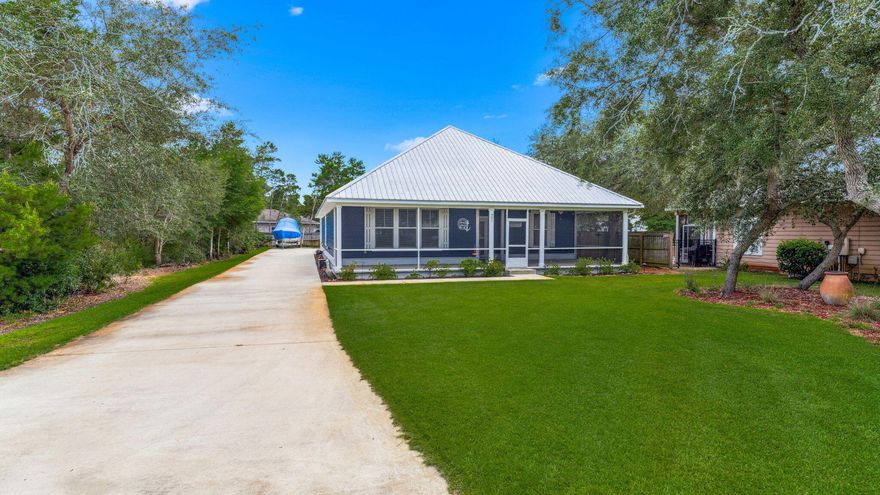 Do you enjoy sitting on your porch and watching the dolphins play?  Look no further - Welcome to this stunning, like-new home in the sought-after bay front community of Pelican Bay--designed with style, space, and flexibility for full-time living or the perfect second home.  This beautifully crafted 5-bedroom, 3-bath residence features a thoughtfully planned layout with a first-floor primary suite, three additional bedrooms and a full bath on the main level, plus a spacious upstairs bedroom with its own full bath--ideal for guests or a private retreat. Enjoy open-concept living and dining areas, a large kitchen with ample cabinetry, a walk-in pantry, and easy flow for entertaining.  Other standout features include an oversized two-car garage, additional parking, and a whole-house generator for added peace of mind. Located in Pelican Bay, a gated, boutique community amenities include a tennis and pickle ball court, bay front park , dock to fish, pull your boat up for loading and unloading, drop in your kayak or paddle board. All of this with LOW HOA fees about a mile to shopping, restaurants and entertainment at Grand Boulevard, as well as the hospital and just minutes to the beach.