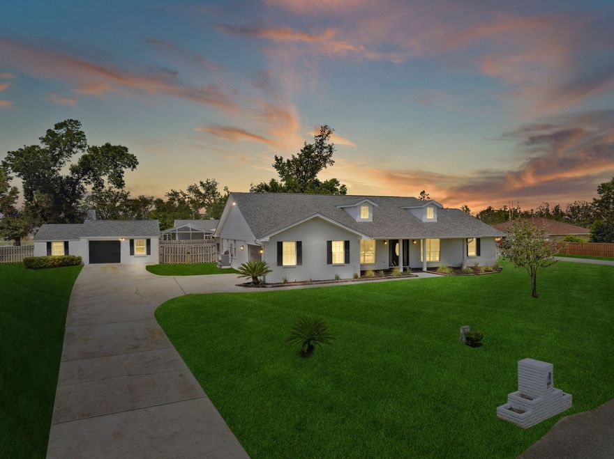 This beautifully renovated home is in a quaint neighborhood on a cul-de-sac street on an oversized corner lot with deeded access to Deer Point Lake. The spacious covered front porch offers views of Deer Point Lake. The open floor plan has plenty of space for anyone to enjoy. The primary suite features two spacious walk-in closets, a large tub, a separate shower, and double vanities. The living room is oversized, with an electric fireplace and access to your heated cooled sunroom. The dining room and office are convenient to the living areas. The kitchen has solid surface countertops and a breakfast bar. Outdoors you have a covered pavilion that will fulfill all outdoor entertaining needs and an additional detached garage that offers extra parking, a workshop, a home gym, and storage.