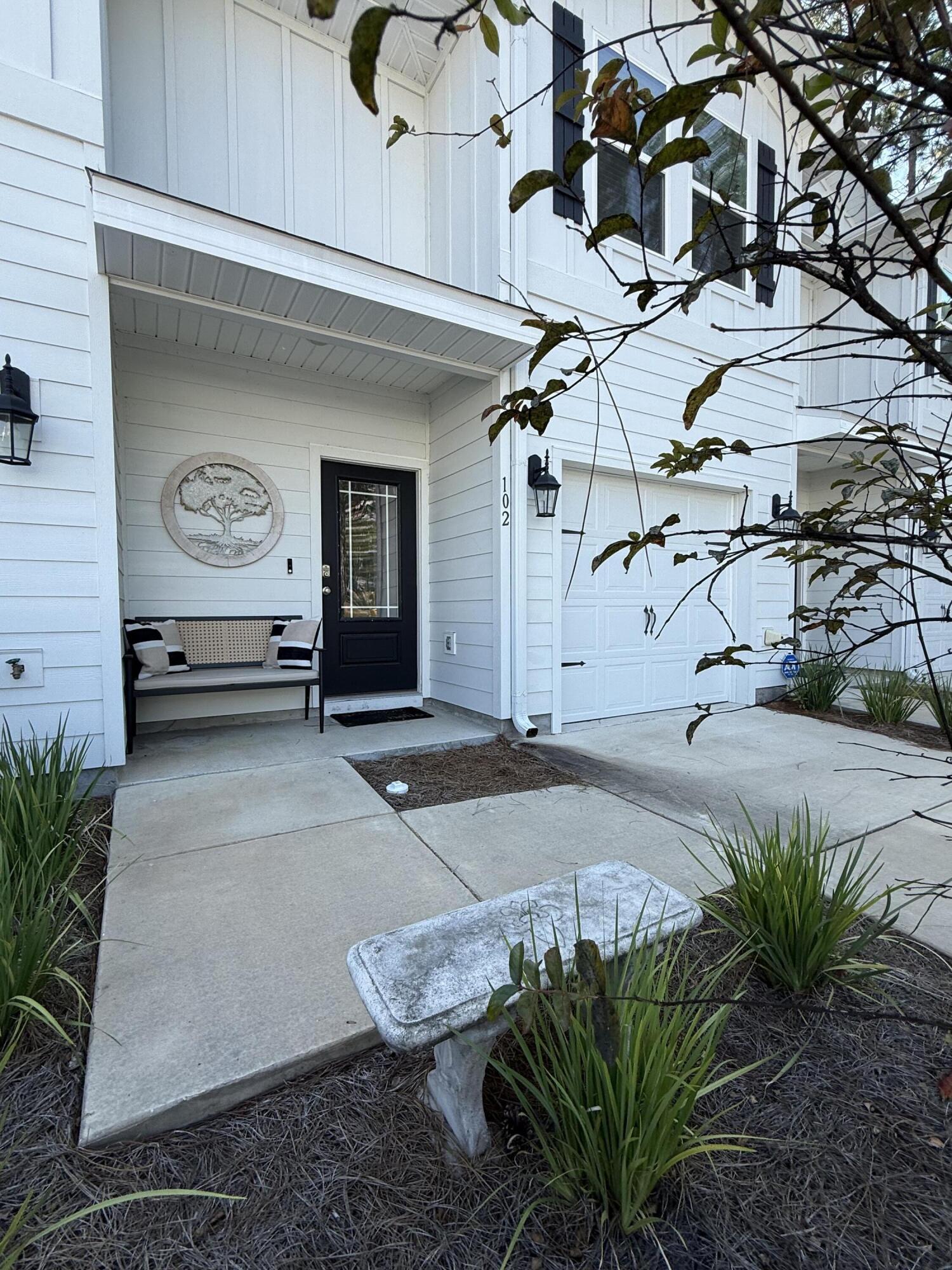 This totally amazing townhome, in the desirable Ward Crossing neighborhood, is all about location, location, location - and trust us, it's gonna be a total game-changer for your lifestyle. We're talking super close to the brand new Panama City Beach Hospital and Medical School, literally only ONE mile, not to mention those gorgeous white sand beaches along the beautiful Emerald Coast, a mere 3.3 miles away - talk about endless possibilities! And because we know you're a jetsetter at heart, you'll love being just 14 minutes away from the Northwest Florida Beaches International Airport - you're just a flight away! And let's not forget about Pier Park, where you'll find an awesome array of restaurants, eateries, and shops just waiting to be explored - it's like, the ultimate life of wonder, joy, and limitless potential! Now that we've discovered the townhouse's exceptional location, let's examine the outstanding features that make it a true gem. Nestled in a serene back corner, giving privacy, this three-bedroom, two-and-a-half-bath haven boasts breathtaking wooded views, it's across from the over-flow parking, making effortless accessibility for guests, and an array of luxurious features, including premium vinyl flooring, exquisite granite countertops, and a spacious floor plan perfect for relaxation or entertainment. The charming patio area invites you to unwind, while the garage features a premium concrete coating with a lifetime warranty, offering peace of mind and freedom from worry. We must not forget about the stunning resort-style pool the community has to offer, surrounded by the lushness of the area, providing plenty of relaxation and serenity. There is also a playground close by for the kiddos! This property is definitely one you don't want to miss!