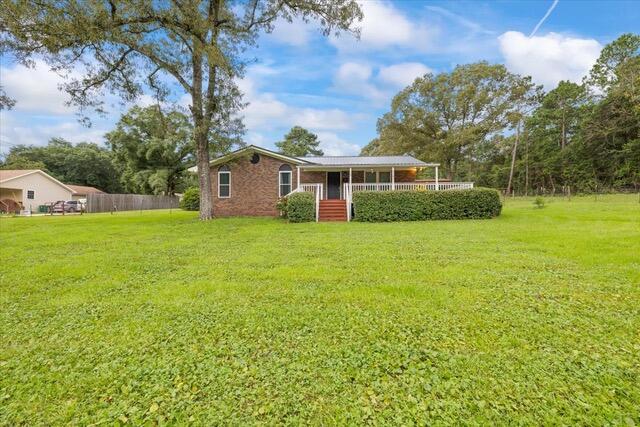 Charming Brick Home on 1.06 Acres - Just Listed!This well-maintained brick home is situated on a spacious 1.06-acre lot.. It offers peace and privacy with very few neighbors. Inside, you'll find wood floors in the bedrooms and a welcoming layout that flows out to both front and back decks--perfect for relaxing or entertaining. Additional features include a durable metal roof, a concrete storage shed, and a two-car detached carport.Homes like this don't come along often--schedule your showing today before it's gone! Pets okay with breed approval and pet fee. Available Oct 1