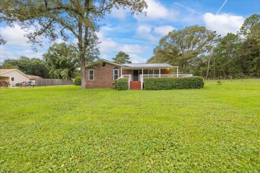 Charming Brick Home on 1.06 Acres - Just Listed!This well-maintained brick home is situated on a spacious 1.06-acre lot.. It offers peace and privacy with very few neighbors. Inside, you'll find wood floors in the bedrooms and a welcoming layout that flows out to both front and back decks--perfect for relaxing or entertaining. Additional features include a durable metal roof, a concrete storage shed, and a two-car detached carport.Homes like this don't come along often--schedule your showing today before it's gone! Pets okay with breed approval and pet fee. Available Oct 1