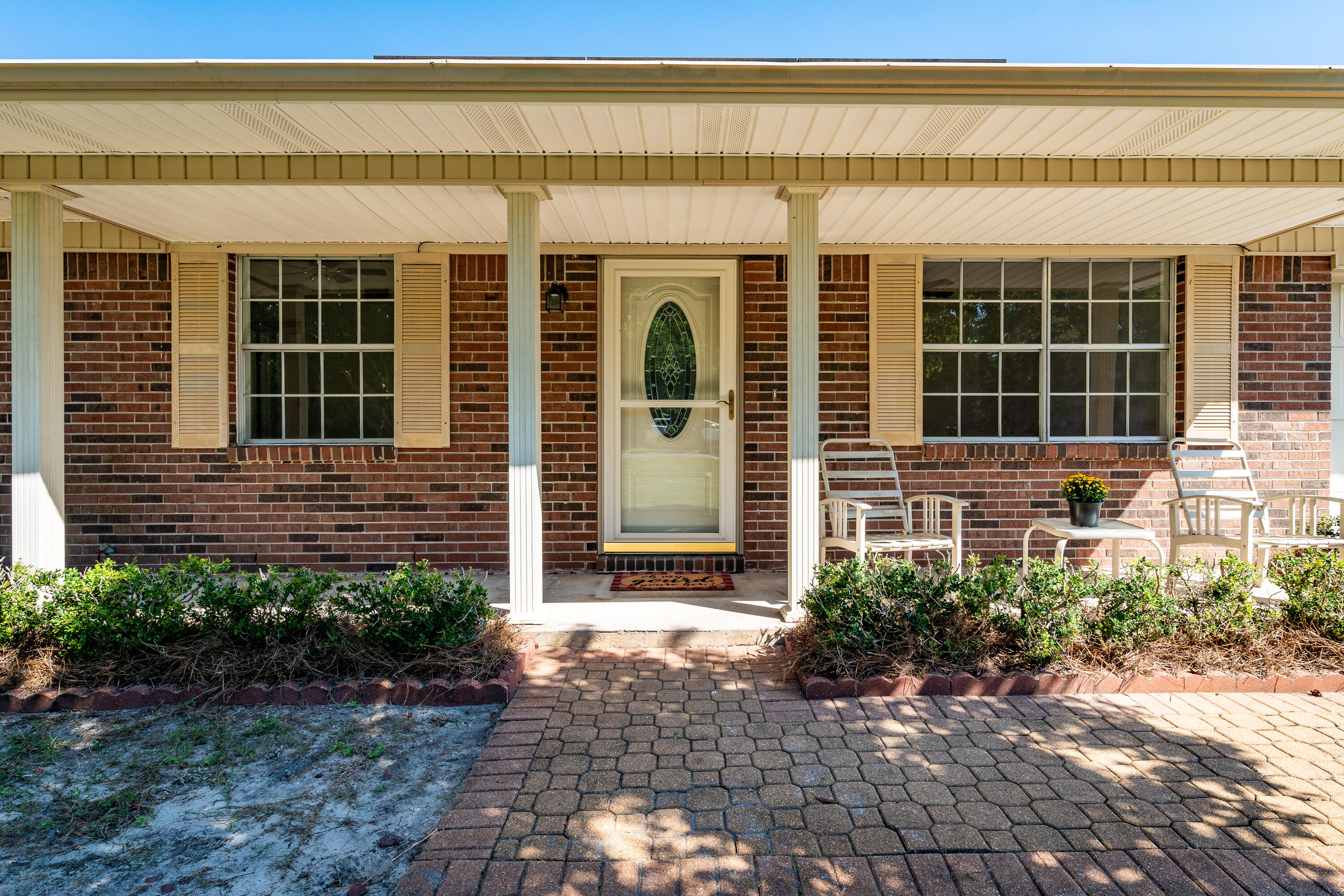 Welcome to this beautifully refreshed 4-bedroom, 2-bath ranch-style home situated on a desirable corner lot. Step inside to a spacious living area filled with natural light, perfect for gatherings and entertaining. The home features fresh paint and brand-new carpet, creating a clean, modern feel.The kitchen opens up to the large, bright living space, ideal for both everyday living and hosting guests. Step outside to your own private oasis -- a sparkling in-ground pool and a large covered patio for outdoor dining or enclosed Florida room for relaxation.This home includes a 1-car garage and offers plenty of storage space. The corner lot provides extra privacy and room to enjoy your surroundings.Move-in ready, this home is perfect for anyone looking for a serene retreat!