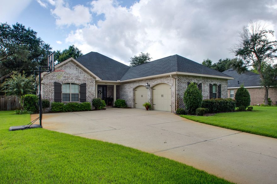 Gorgeous executive style home shows like a Southern Living model, with high ceilings, 8 ft doors, 4 large bedrooms, 3 full baths, screened in porch and luxurious lagoon saltwater, gunite, in-ground pool! Available immediately! Open concept floor plan features freshly painted Great Room with with dual surround sound. Kitchen is a cooks delight with tons of cabinets, gas stove, and large kitchen island with sink. The screened in porch is plumbed for gas, water and cable TV, for an outdoor kitchen, if you'd like. Backyard is huge, even with the pool. The well provides low cost watering for the newer Zoysia grass. Whole house water filtration system, plus constant gas hot water circulation. Master bath has double vanities and Huge walk in closet. Convenient to Eglin AFB, great schools,