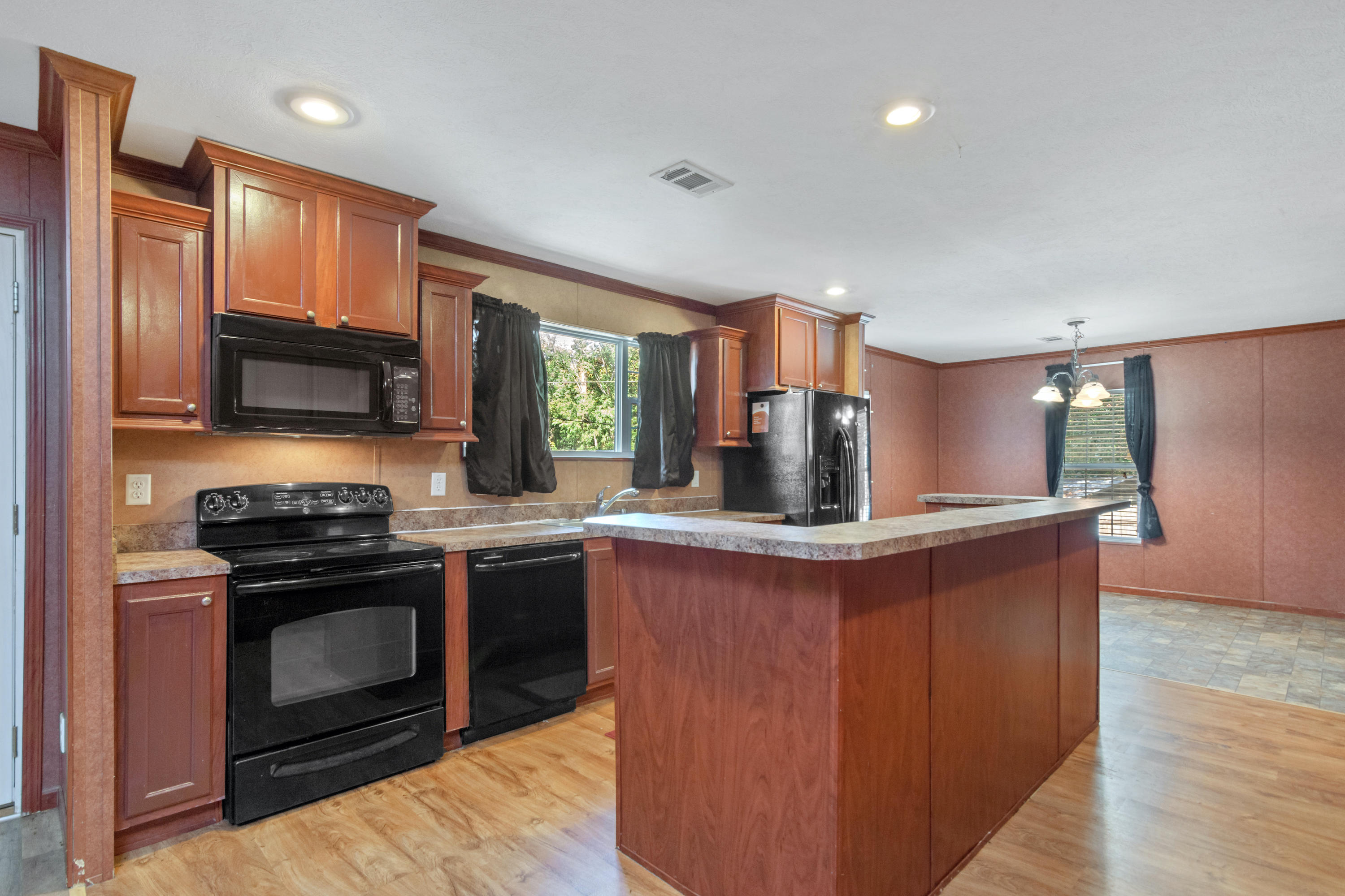 **UPDATE**Catch it quick! This 4/2 cozy family home, one block from the Choctawhatchee Bay is now sporting fresh paint! Each of the 4 bedrooms has their own walk-in closet, and the open concept living area features a large kitchen island and fireplace. Perfect for cozy family living.The home boasts outdoor living at it's best. With outside storage, two decks, picnic table and benches, awesome grill, beautiful gardens and a full chicken run.Convenience is an understatement as you are just outside of Niceville and the Mid-bay bridge connector.A single family modular home in Walton County means lower property taxes for you. Home meets 2010 building codes.