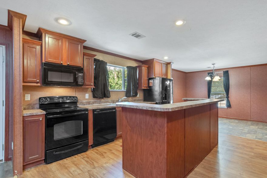 **UPDATE**Catch it quick! This 4/2 cozy family home, one block from the Choctawhatchee Bay is now sporting fresh paint! Each of the 4 bedrooms has their own walk-in closet, and the open concept living area features a large kitchen island and fireplace. Perfect for cozy family living.The home boasts outdoor living at it's best. With outside storage, two decks, picnic table and benches, awesome grill, beautiful gardens and a full chicken run.Convenience is an understatement as you are just outside of Niceville and the Mid-bay bridge connector.A single family modular home in Walton County means lower property taxes for you. Home meets 2010 building codes.