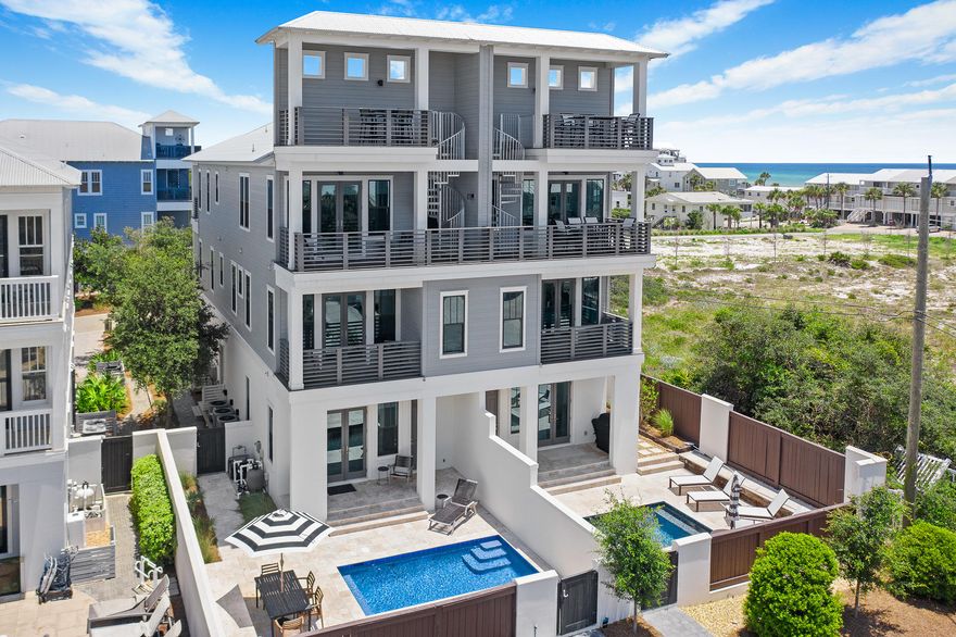 SEE VIDEO! Exemplary coastal design offers expansive gulf views; steps from beach access. Main residence consists of 4 bedrooms en suite; plus additional separate living quarters complete w/full bath & kitchenette. Bonus room opens to a private courtyard retreat w/heated pool enclosed w/privacy fence perfect for outdoor entertaining. First floor features an oversized garage, separate living area along with elevator access. Second floor comes w/two master suites complete with private balcony & gulf views to include an additional bunk room en suite.  Main living along w/additional Master en suite w/private balcony is found on the third floor along w/additional balcony & observation tower leading to a fourth level where sunset views may be enjoyed.IMMACULATE NEVER RENTED W/170K PROJ. INCOME