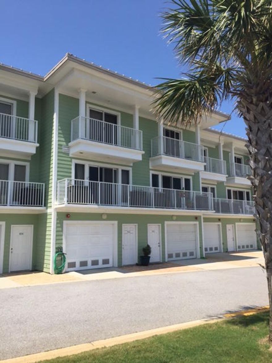 This stunning 2 bedroom 2.5 bath TownHome with tandem 2 car garage, 4 balconies on beautiful Pensacola Beach has breathtaking views of the Sabine & Gulf & is only steps from the water. Right out your back door is Little Sabine which is the best area for paddle boarding, fishing, kayaking, and the Blue Angels beach show! It is 2006 construction built to the latest codes and renovated in 2011.
Updates 2011 Bamboo Flooring throughout, Custom kitchen cabinets with marble bar & countertops stainless sinks, Stainless appliances in kitchen include dishwasher, refrigerator, microwave oven, convection/conventional oven, multi colored glass splashback.
Master Bathroom custom glass enclosed walk-in shower, vanities w/ marble countertops & custom cabinets