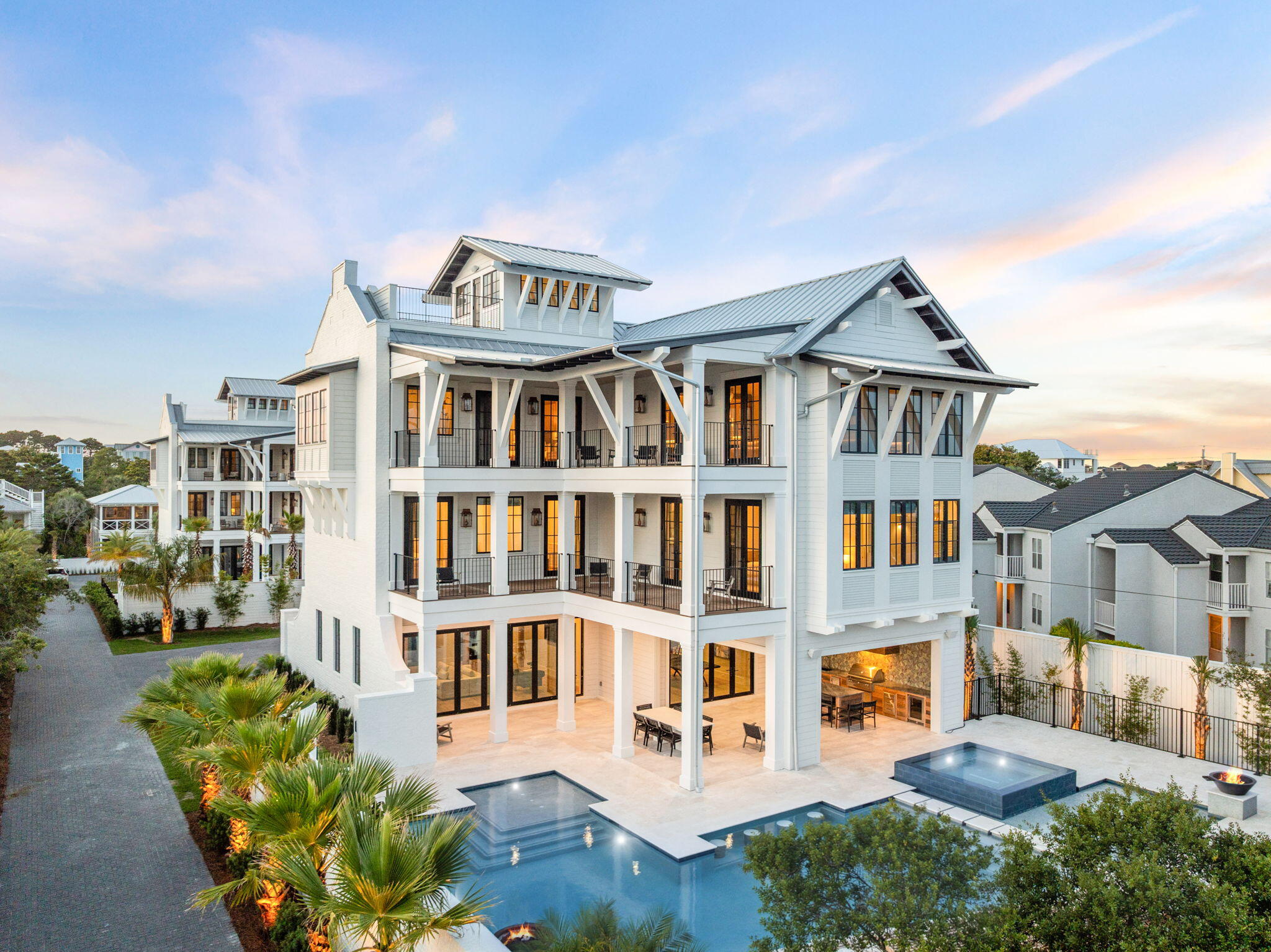 Welcome to ''The Bluffs at Dune Allen Beach'', 5012 W County Hwy 30A is an exquisite new construction home, seamlessly blending the tranquility of beach town living with luxurious modern amenities. This three-level estate offers an idyllic retreat with its private pool, hot tub, and expansive outdoor living spaces totaling over 7076 square feet.As you step into the grand foyer on the first floor, you'll be greeted by a spacious Game Room, perfect for family gatherings and entertaining friends. Adjacent to it, the expansive Living Room invites relaxation with its comfortable seating and serene views. The thoughtfully designed ''Bunk Area'' offers additional sleeping space, making it ideal for children or extra guests. Ascending to the second floor, you'll discover a haven of tranquility in the primary bedroom, a sanctuary complete with a spa-like ensuite bathroom and a private balcony that captures stunning sunset vistas. The floor also hosts five elegantly appointed guest bedrooms, each offering privacy and comfort for your guests.
The third floor is an entertainer's dream, featuring another primary bedroom that epitomizes luxury. The gourmet kitchen is a chef's delight, equipped with top-of-the-line appliances, custom cabinetry, and a large island perfect for culinary creations. The adjoining living room, with its vaulted ceilings and panoramic windows, provides a light-filled space for socializing and relaxation. Additionally, the third floor includes versatile attic space, suitable for storage or creative use.
This magnificent residence boasts a total of seven bedrooms, plus the charming bunk area, ensuring ample accommodation for family and guests. The high-end finishes throughout the home include rich hardwood floors, custom millwork, and designer lighting, which enhance the aesthetic appeal and comfort.
The property's outdoor spaces are designed for both relaxation and entertainment. Enjoy the private pool, hot tub, and multiple outdoor seating areas perfect for alfresco dining and lounging. The observation deck offers a panoramic view of the stunning Santa Rosa Beach sunsets, making it a highlight of this luxurious retreat.
Situated in a serene location yet conveniently close to Dune Allen Beach, 5012 W County Hwy 30A provides easy access to a variety of restaurants, shops, and beachside activities. The strategic location near popular local destinations such as Gulfplace, Shunk Gully, and the Santa Rosa Golf and Beach Club ensures a lifestyle of convenience and leisure.