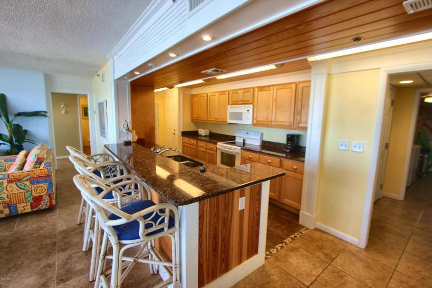 This beautiful 1769 square foot, extensively upgraded, second floor, 3bed/3bath condo is considered by many to be the best floor-plan on the beach! Property enjoys floor-to-ceiling views of the Gulf from all three bedrooms and great room that steps out to one of two large private balconies. Extensively remodeled and meticulously maintained. Conveys fully-furnished, turnkey, and rental ready. Tiled living area means easy clean-up and ultra-low maintenance. Both master bedrooms are gulf front and have access to the enormous main balcony. Both also have en suite baths that feature new natural maple cabinets, a large over sized cultured marble tub, and double vanities