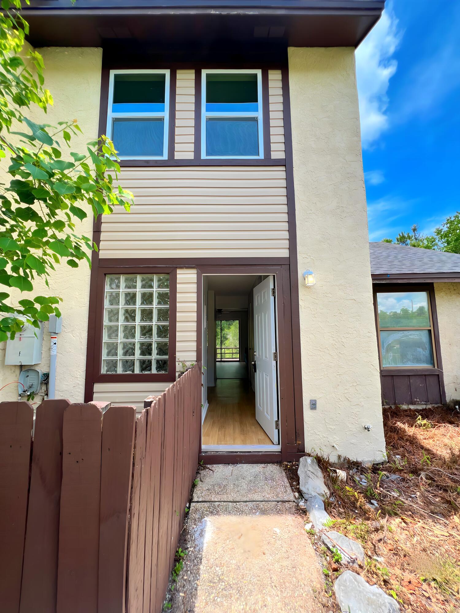 Move In ready! No homeowners association !Welcome to this newly renovated townhouse, ideal for first-time homebuyers or as a rental property. This home features two bedrooms and one and a half baths, with modern updates throughout.The living space is bright with new windows and fresh paint inside and out. The kitchen is updated with new cabinets and sinks. Upstairs, the attic has been renovated, including new plumbing.New floors have been installed throughout, replacing old carpets. The back of the house now has new wood flooring and railing.There are no HOA fees, making this a great opportunity for easy living or investment. Schedule a viewing today!(Measurement are approximate, please verify)(Furniture not included)