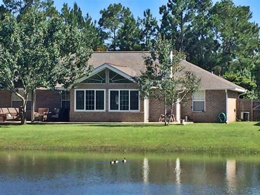 Located just far enough away for tranquility, this 4 bedroom 2 bathroom home has had new LVP and baseboards installed throughout. There are large windows allowing plenty of natural light in.   The addition of the sunroom makes for a great way to view the lake on a nice evening.
