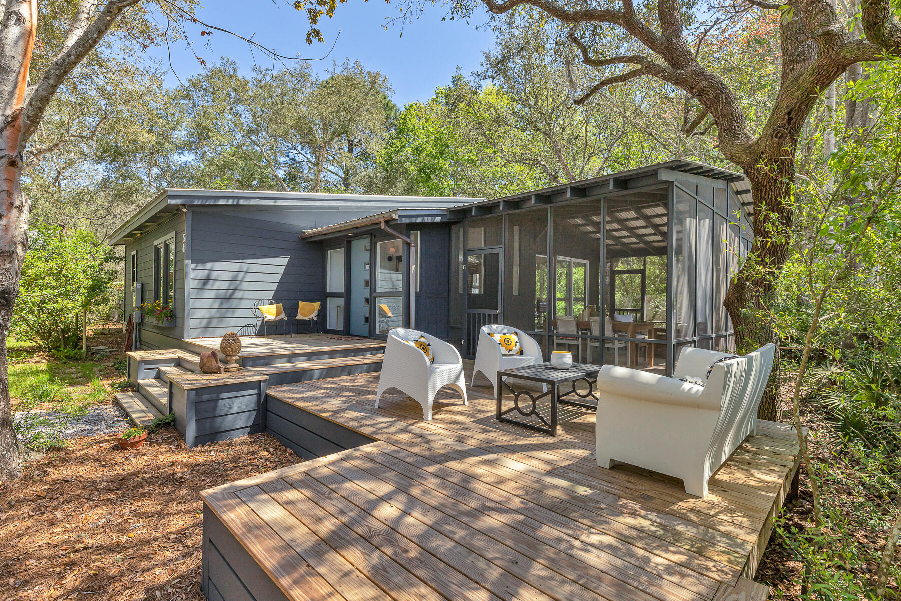 Adorable private abode situated among lush vegetation and surrounded by gorgeous live oak trees. The main house features 3 bedrooms, and 3 full baths, the carriage house features living, kitchen and full bath. Property sits on approximately .45 acres and is a short drive to both the Choctawhatchee Bay (Pilcher Park) and to the sands of the Emerald Coast.  Unique finishes in the property include heart pine floors, painted hardwood floors, and numerous outdoor living spaces including 2 private, spacious outdoor showers.  This private enclave also backs up to a creek that feeds into the Bay, a nature lovers paradise!  Walton County Commissioners and the Tourist Development Council have voted to purchase a piece of property for an outdoor amphitheater and stormwater conservation runoff.  This