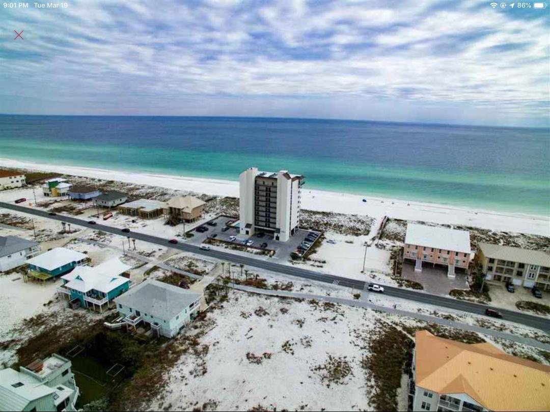 Incredible Opportunity to One-of-a-kind residential lot in beautiful Navarre Beach! One of the most desirable beach communities. Only one remaining, directly across from the Gulf and full unobstructed views. Bay views in the rear of the lot. Lot size is 90' X 125'. No HOA fees. No build out period. Right in front of your house, walk to the emerald green waters of the Gulf of Mexico. Incredible opportunity to build your dream home, vacation rental or second home with breathtaking views of the Gulf and Bay. Walk our your front door and on to the beach! Beach front lots costing several hundred thousands more. You can have the best of both worlds. Watch the sunrise and sunset from your front deck or on the beach! Walk or bike to the National Sea Shore.