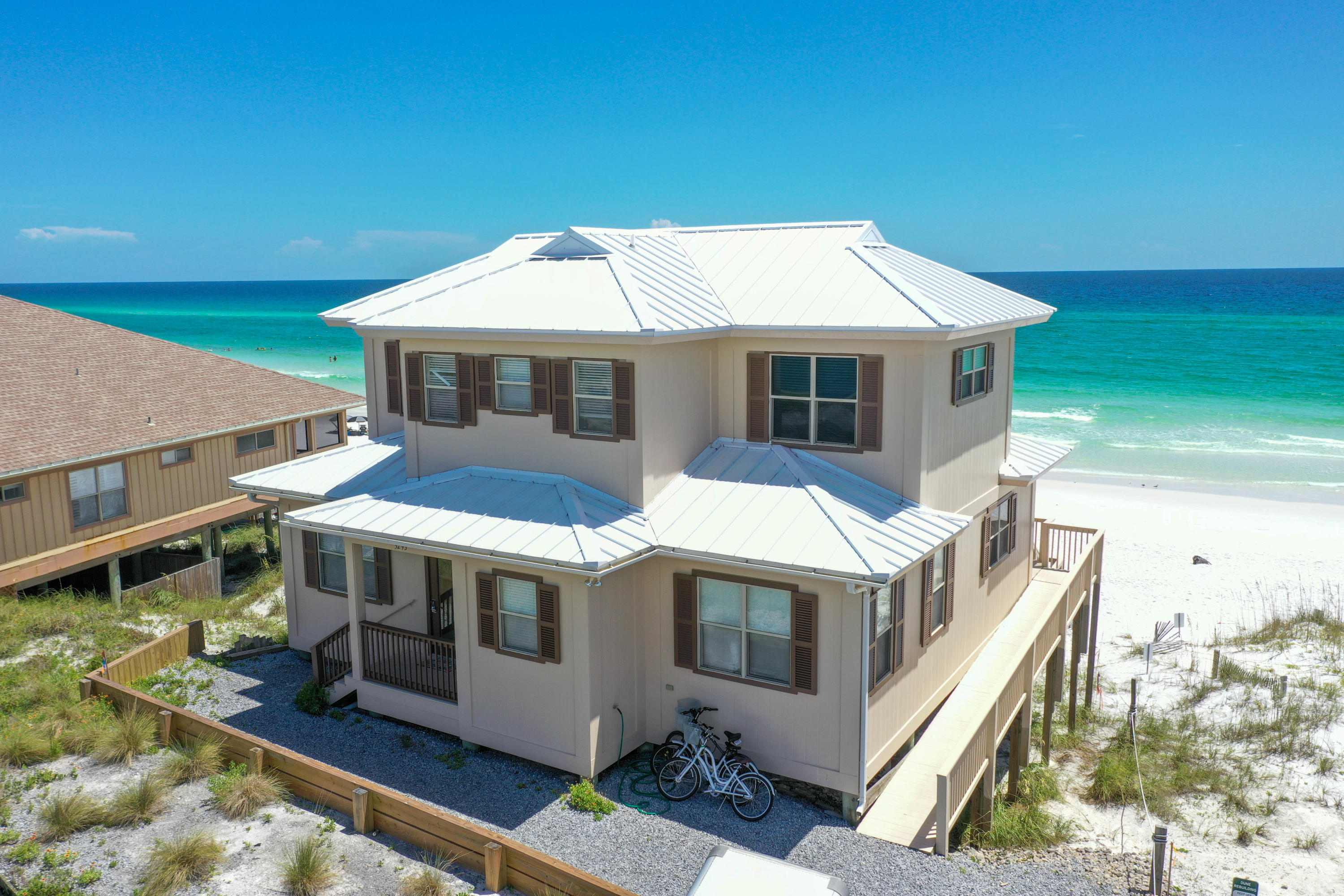 PRICED BELOW APPRAISED VALUE**Dune Allen Beach is a popular resort area on the west end of Scenic 30-A. It consists of a mixture of older, eclectic Florida cottages and new, custom homes located directly on the Gulf of Mexico and across from the unique coastal dune lakes of Oyster Lake and Lake Allen. The Allen House is located directly on 60 feet of beautiful white sand and just steps to the emerald green water of the Gulf of Mexico. Main floor is open concept kitchen, dining area and living room. Two bd/ two baths. Up the stairs are two more bedrooms with shared bath. And a bonus room that can be used as a game room or a quiet place to read or enjoy the sunset. Covered porches span the entire width of the home and offer unobstructed full views to the East and to the West