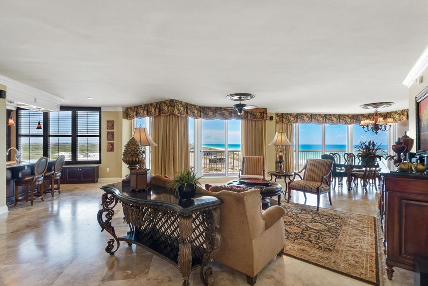 Rarely does a unit in the coveted 01 stack become available. This condo is bordered to the east by Henderson Beach State Park providing unobstructed views as far as the eyes can see. The condo has some incredible upgrades including relocating the kitchen to provide for a huge living and dining area surrounded by a wall of windows. A large built-in wet bar with ice maker and wine fridge has been added. Beautiful polished travertine flooring adorns the foyer, living, dining, kitchen areas and hallways. There are 3 bedrooms all with insuite baths and an additional half bath. Additional upgrades include plantations shutters, remote controlled custom made draperies, high end appliances, furnishings, art and accessories throughout. St. Thomas boasts semi-private elevators that opendirectly