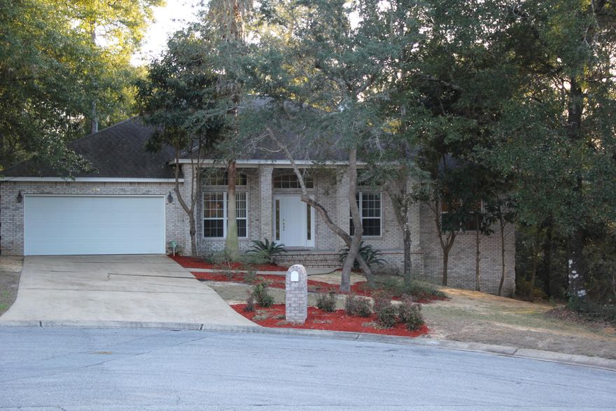 This beautiful custom built Jimmy Parish home sits on a private, wooded lot off the 17th green of Rocky Bayou. This home features high ceilings, split floor plan, large kitchen, french doors and large office area that could be used as a spare bedroom. Enjoy the serenity of the untouched nature of rocky bayou from your beautiful deck. Take advantage of the stocked pond which is only a 2 minute walk away. Don't miss the opportunity to live in the highly sought after community of Rocky Bayou.