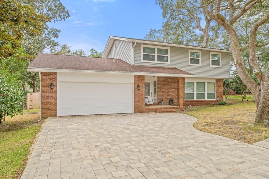 Welcome to this completely remodeled 4 bedroom cul-de-sac home just one block from the water. This home features a formal dining room and living room, a brick fireplace in den and large bedrooms with ample closet space.  The home will have a new roof before closing. The kitchen has been completely remodeled and has stainless steel appliances and an abundance of custom cabinetry.  The oversized master bedroom has a large custom closet and all bathrooms have matching granite countertops.  This home has all newer LVP flooring, with no carpet! Relax in the large fenced in backyard with beautiful trees, an entertainment area under a large gazebo, pavers, and plenty of space for a pool. Schedule your exclusive showing today for this private remodeled home in the great neighborhood of Kenwood!