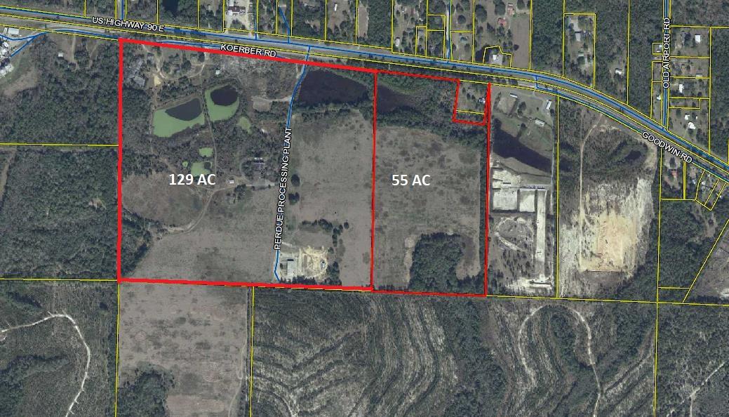 184 acres. zoned industrial. 8400 SF metal building used as a semi truck repair shop for Farm Farms trucks. Subject property also has two houses in fair condition that were used for offices.Over 3000 feet of road frontage. Florida Gulf & Atlantic RR fronts the subject property. A railroad spur to the subject property from the Florida Gulf & Atlantic RR track is possible.