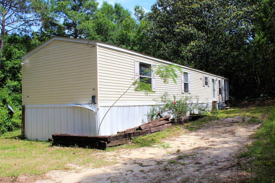 **CASH ONLY** Handyman's dream! Nestled on 2.5 acres of privacy, a little work could make this a beautiful country home.