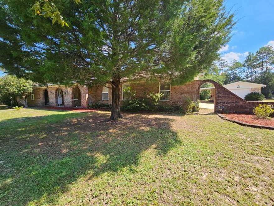 Welcome home to this all brick, ranch style home nestled on a 1.16 acre lot!  Features include a brick one car garage, a one car carport, single and double gate entry, barn style shed, and a place to park the RV equipped with a 30 amp RV plug and water!  Step inside to a spacious, split floorplan offering 4 bedrooms, 2 baths, large laundry room, office or bonus room, enclosed garage space AND a Florida Room!  Spacious living area sports recently replaced carpet.  Tiled dining room, just off the Florida Room, features a brick woodburning fireplace perfect for firelit dinners.  Seller to replace roof at closing, with a full price offer.  All just minutes from Publix, North Okaloosa Medical Center, schools, shopping and some fabulous local eateries!   Home is being sold AS IS and does qualify for the FHA and VA rehab loans.  Buyer to verify any items deemed important such as room measurements and school zones.  