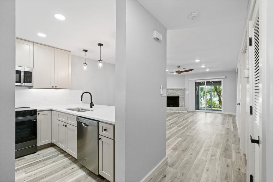 Beautifully renovated 2BR/2.5BA townhome with over $90K in upgrades--nearly every feature is new, including paint, trim, flooring, windows, lighting, fans, all doors, bathrooms, fixtures, and Quartz counters throughout. The kitchen features soft-close cabinets, Quartz countertops, under-cabinet lighting, new stove, and sink. Enjoy the cozy brick fireplace and relax on the enclosed patio and deck. Roof replaced in 2022, HVAC in 2021. Steps to the community pool and less than a mile to the Gulf. Ideal as a primary home, vacation getaway, or rental--style and comfort await.
