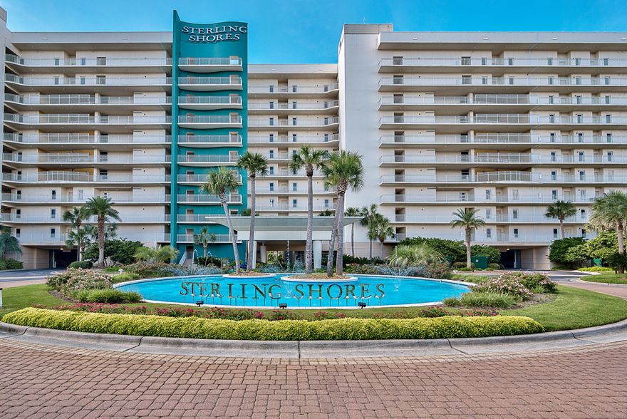 You can see from the photos, this condo is lavishly decorated; however, the Seller IS NOT CONVEYING the contents of their property. Window treatments will remain if the Buyer would like to use them. Two Master Suites, one is the lock-out suite with private entrance, tiled balcony, luxurious bath w/Jucuzzi, separate shower and walk in closet. All living areas are tiled including the 3rd bedroom. Custom crown molding in ALL areas of condo, custom trim on baseboards, chair rail and doors. Upgraded light fixtures thru out incl under counter lighting in the kitchen & chandelier in dining room. All bath fixtures upgraded, cast iron sink & corian countertops in kitchen & baths. 4 walk in closets w/extra cabinetry added to 3. Large Master Bath also opens up to 427' tile balcony with spectacular views of the Gulf and surrounding areas. . Sterling Shores has a private beach club w/seasonal heated pool and grill area, a 4300' lagoon pool, BBQ area, movie theater, exercise room and lovely lobby to welcome home owners and guests.  It's conveniently located to dining, shopping and entertainment for all.  This would make a perfect place to call home.  Bring your Buyer who is looking for a full time residence who is downsizing, purchasing a second home or rental property.