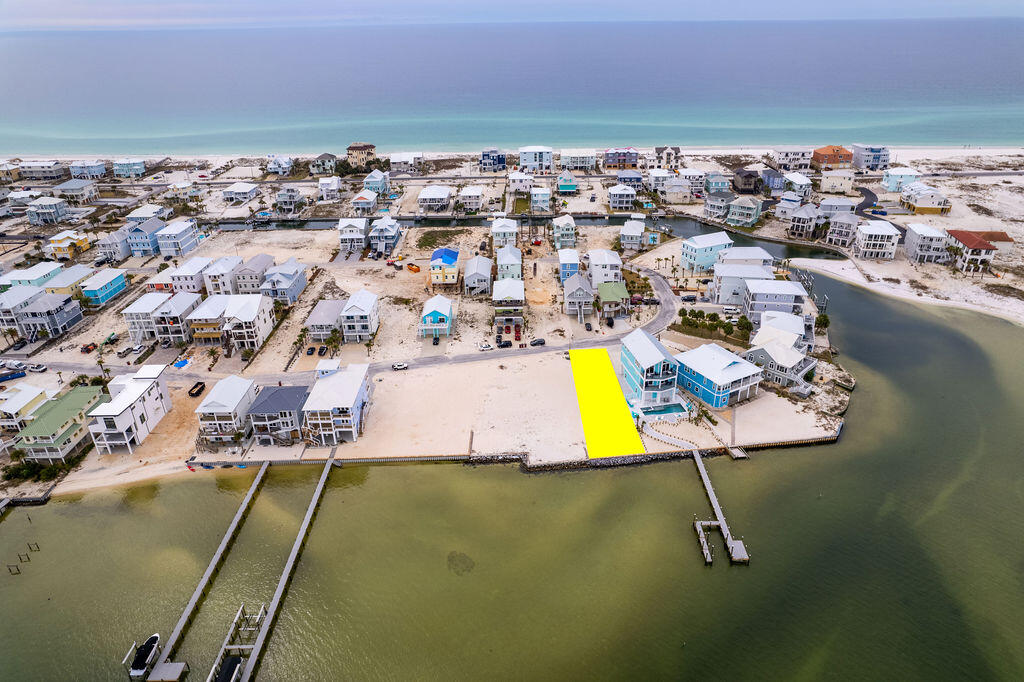 **SELLER FINANCING 5.5% INTEREST $550K DOWN 30 YR/5 YR BALLOON**The west end is the best end; welcome to your future oasis on Navarre Beach. Lot 19 in Grand Navarre is a stunning waterfront gem that boasts 45ft of width and a staggering 143ft of depth directly on the Santa Rosa Sound featuring a brand new seawall. The property is angled for not only sunset views but unobstructed views of the National Seashore coastline; a rare treat. Just a stone's throw distance to the Gulf of Mexico and public beach access; this location is key for building your personal peaceful retreat, expanding your investment portfolio by building a renters dream destination, or becoming a full time resident of the tight knit community of Grand Navarre with NO HOA. This blank canvas with panoramic views allows for endless possibilities! Let's bring your vision to life. Ask about custom drawn plans for this premier property.
