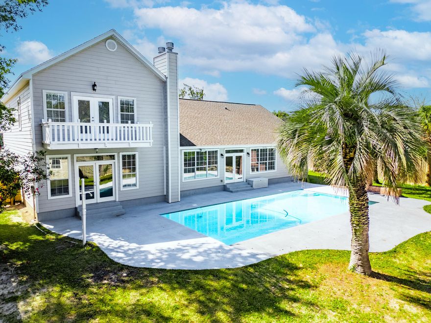 A charming home nestled in the heart of Destin features five bedrooms, three baths, and 3,312 sq. ft. of living space. You'll love the 37 x 18 in-ground pool, fenced yard, 2-car garage, and dual driveways. With two master bedrooms, each boasting an en-suite bathroom, along with two fireplaces and two additional bedrooms downstairs, this home offers both versatility and comfort. The kitchen showcases stainless steel appliances, dual pantries, and granite countertops, while the bright and airy great room boasts high ceilings and French doors leading to the pool. Conveniently situated just minutes away from top-rated schools and the Destin Harbor.