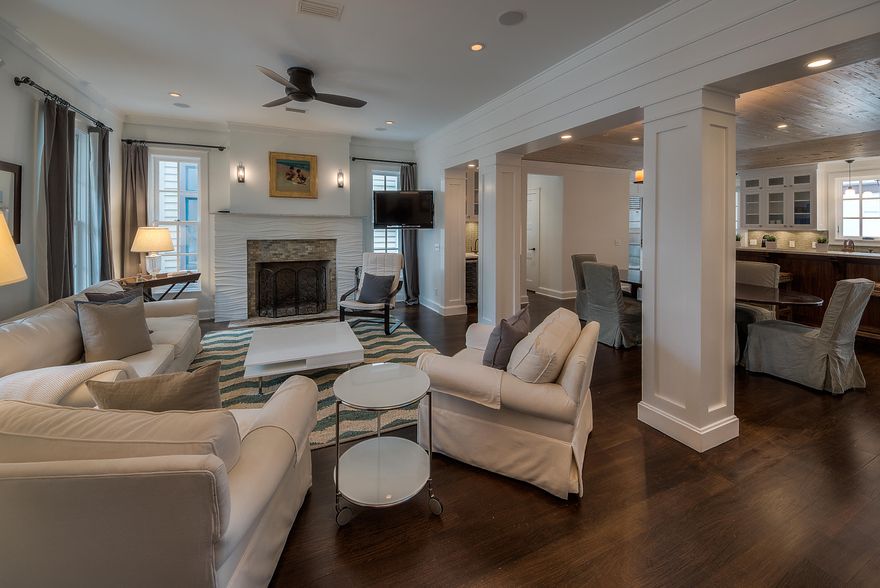 Designed by award winning architect, Tim McNamara, this is a unique three story courtyard style home in the heart of Rosemary Beach. This custom stucco home offers many luxury design features throughout: Brazilian walnut hardwood floors, Ann Sack glass tile and pebble bath flooring, Walter Zenger tile and bowl sinks. The open living and dining room create plenty of space for entertaining family and guests. The pecky cypress tray ceiling and Modular Arts Dune fireplace in the living room make it a warm and cozy environment. The kitchen opens on to the courtyard which hosts a summer kitchen with Viking appliances, outdoor fireplace and infinity edge soaking pool. Take your elevator to the 1,200 square foot master suite on the third floor. The suite has a fireplace, wet bar and viewing tower