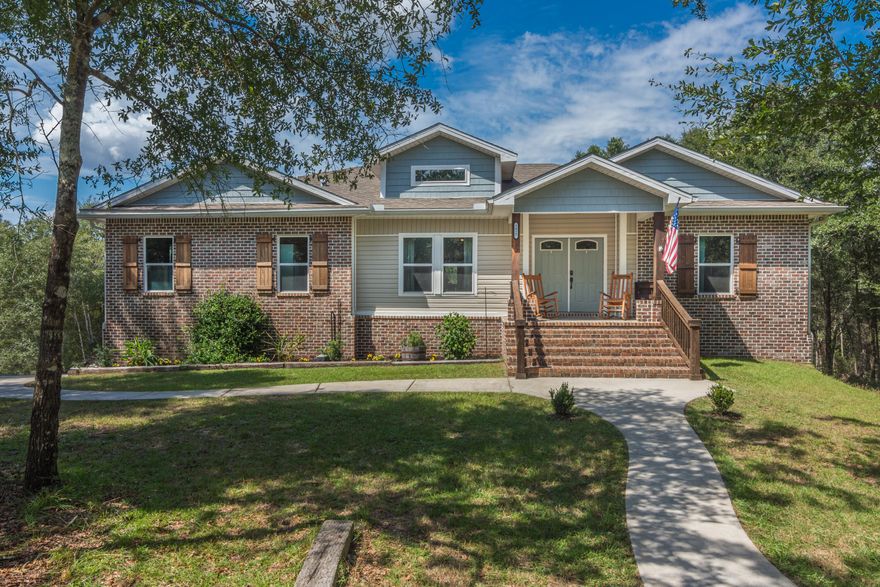 One of a kind custom southern living 5-bedroom 3 bath plus flex room beauty sitting on over an acre with a creek in the backyard ready for you to call it home!!! First as you walk up the grand porch steps you will right away notice the attention to detail with the cypress trim and brick work. Step into the large living room and picture entertaining your family and friends this holiday season. The kitchen boasts ample granite counter and cabinet space to meet all your cooking needs along with stunning slate grey GE appliances,   and a unique copper farm sink. The master suite is spacious and provides privacy from the rest of the bedrooms and overlooks the treetops as well. Step into the master bath with its own brand-new jetted garden tub, walk in shower, and his & her closets. This home