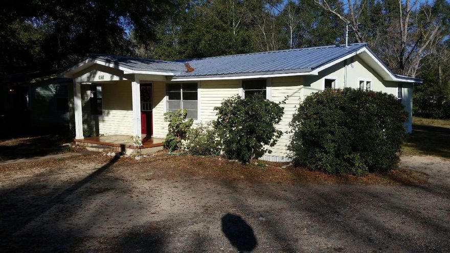 Brand new metal roof on Florida cottage style home. Home is situated in the heart of Crestview on a large corner/double lot surrounded by pretty shade trees. Close to Churches and Youth Center. House features brand new laminate flooring throughout & AC is only 18 months old! Vacant and ready to move in.