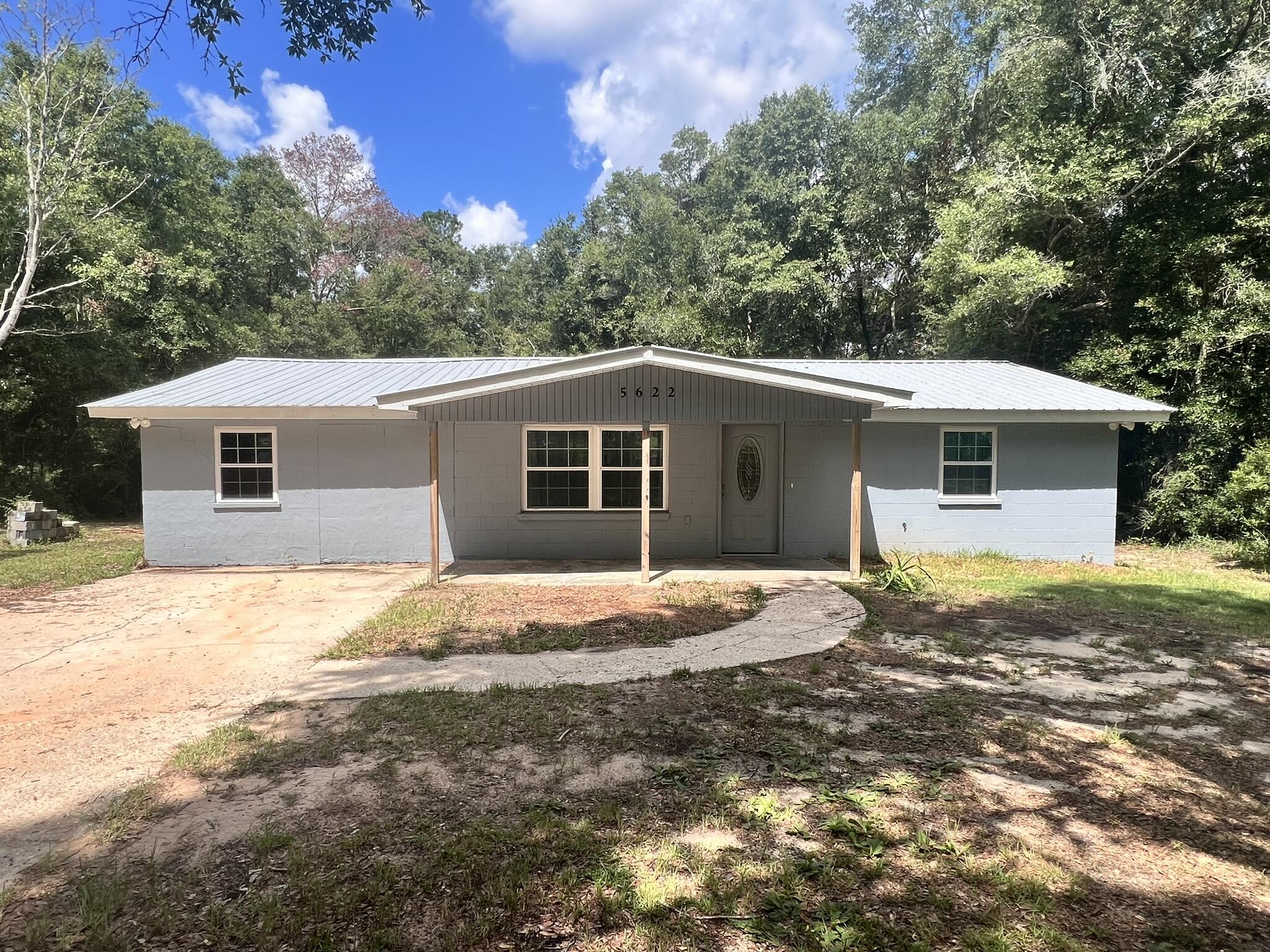 Charming Florida cottage in Baker. The interior has been renovated for a modern look and feel. Newer appliances and AC. The home has a split bedroom design and a master bath with a step-in shower. The home does include an inside laundry room with a stack washer/dryer. There is also a tankless hot water system for fast hot water when needed. The kitchen has all the appliances. A pet will be allowed with owner approval of breed and pet fee, The house will be available on March 4.