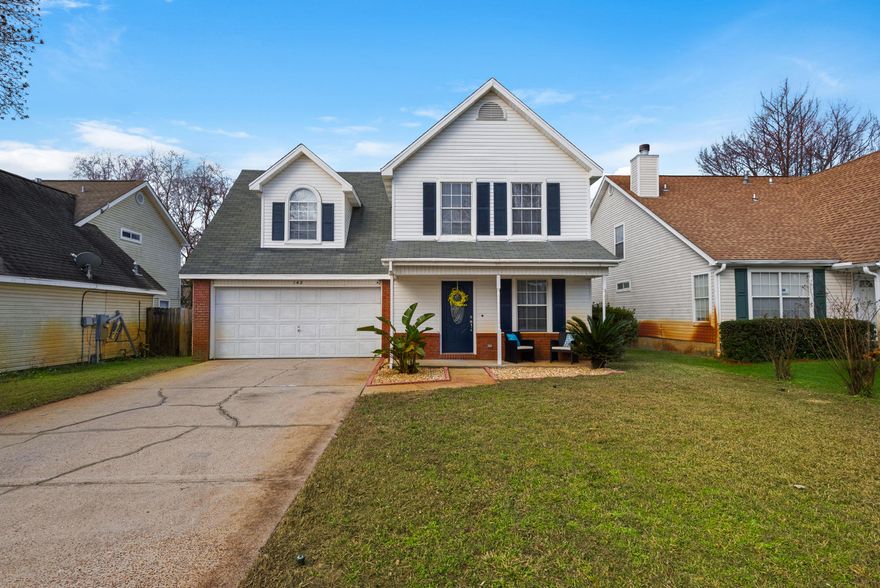 BEAUTIFUL HOME that has had some nice updates! New mahagany door with beveled glass insert.... and after entering home, your breath is taken away by the beautiful wood floors in the living room. The dining has a lovely bay window to look out with new french doors; open kitchen area with additional window for natural light; enclosed laundry room off the dining area; stairs and all bedrooms getting new carpet; 2nd floor hallway also has beautiful wood flooring; the master bedroom is BIG with additional seating area for relaxing while reading a book or place your computer desk here; master bath has double vanity with plenty of space; walk-in closet has inset shelving (California closet). Both spare bedrooms are large. Nice wood deck in the back yard with complete privacy fencing.