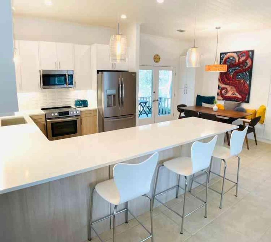 Welcome to 15 Maple Street, a hidden gem one block off 30A.  This location has it all! Conveniently located 2/10 of a mile to the nearest beach access at Gulfview Heights you will never have to fight for a parking spot again!  Enjoy bypassing the traffic on 30A by accessing 393 from the back of the neighborhood.  Within one mile, choose from a variety of restaurants including Shunk Gulley, Mimmos, Local Catch and more.   Hop on the Longleaf Pine Greenway Trail that is 3/10 of a mile from your front door and enjoy an afternoon of hiking.  This home enjoys 2,043 sq feet under roof; 1,637 heated and cooled sq ft and 406 sq ft covered and screened-in porches.  Mature landscaping beautifully details the large, almost 1/4 acre corner lot.  In 2022, the kitchen received a makeover bringing it