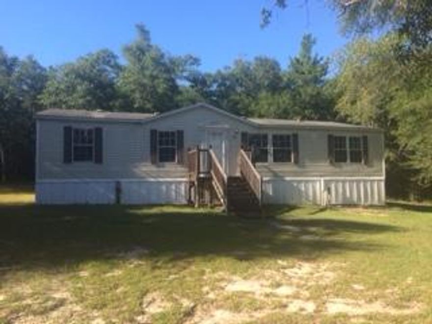 Country Living in DeFuniak Springs, FL! This well kept mobile home sits on a full acre lot and features three bedrooms and two full bathrooms. With over 1500sqft of functional floor plan there is plenty of room for everyone. Kitchen is spacious and offers tons of storage including a pantry, electric stove/oven and refrigerator. Master bedroom has high ceilings and bath has garden tub, separate shower and double vanity.