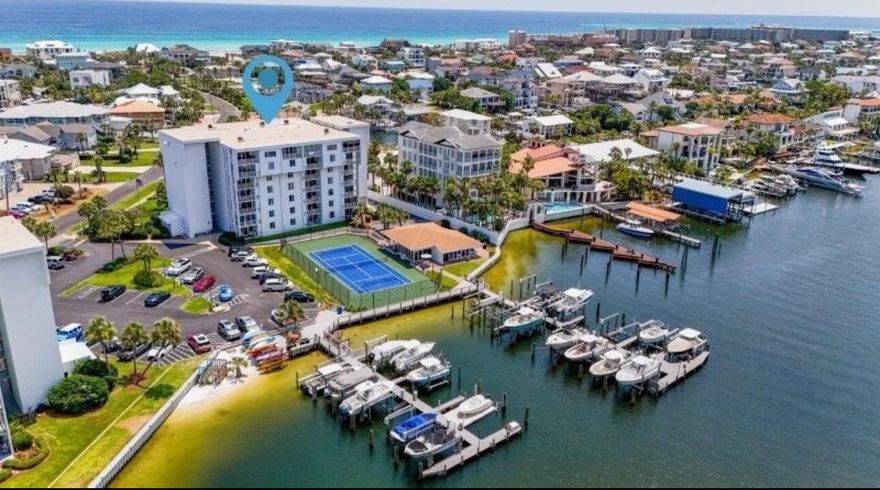 Welcome to a Boaters Paradise!! This Dolphin Point 2-bedroom 2 bath unit with a bunk room/office has been COMPLETELY and professionally renovated with so many details that set it apart from the rest.  Once you enter the unit, you'll walk into a Gorgeous Kitchen with all top-of the line appliances, new cabinets, Quartz counters tops, a stylish backsplash and oversized island with plenty of storage. Main living areas have commercial waterproof flooring (LPV) throughout unit. Both bathrooms have been completely  redone. Master bathroom has a free-standing tub, double vanity and blue tooth speakers throughout both bathrooms. The second bedroom has bunk beds to offer plenty of space for your guests. Other new appliances include stackable washer and dryer, water heater, HVAC system, hurricane window and sliding doors leading out to the balcony. Wiring was replaced with copper throughout unit. Dolphin Point is one of Destin's best kept secrets as a boater's paradise and is situated on Holiday Isle only sets away from the beautiful white sand beaches and a short taxi ride away to all Destin has to offer. Amenities include private gated beach access, large, heated pool, private club house, pickle ball & tennis courts, paddle boards/kayak launch, BBQ grills, golfcart parking and so much more.
This condo is not just a home, it's a lifestyle! Don't miss the opportunity to own this piece of paradise. Call today to schedule a showing and experience all this condo has to offer.