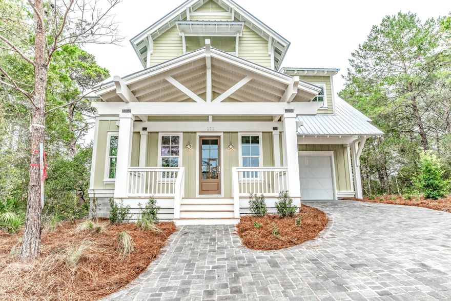 Experience the Boutique Charm of 30A from this Blue Mountain Beach Beauty. Located just steps from the 30a bike path, beautiful white sandy beaches, and fine dining, this home features an open kitchen with large island and open shelves. The unique grunge oxide porcelain tile back-splash adds a bit of old world character while the satin brass cabinet pulls embellish the beauty of the dove gray raised panel cabinetry. Over-sized Island pendants project the cozy charm of silhouettes common in classic homes of the past. The fireplace is surrounded by stunning Aqua Grunge porcelain tile that captures the essence of our beautiful turquoise waters. The screened in back porch, perfect for a peaceful escape, overlooks the