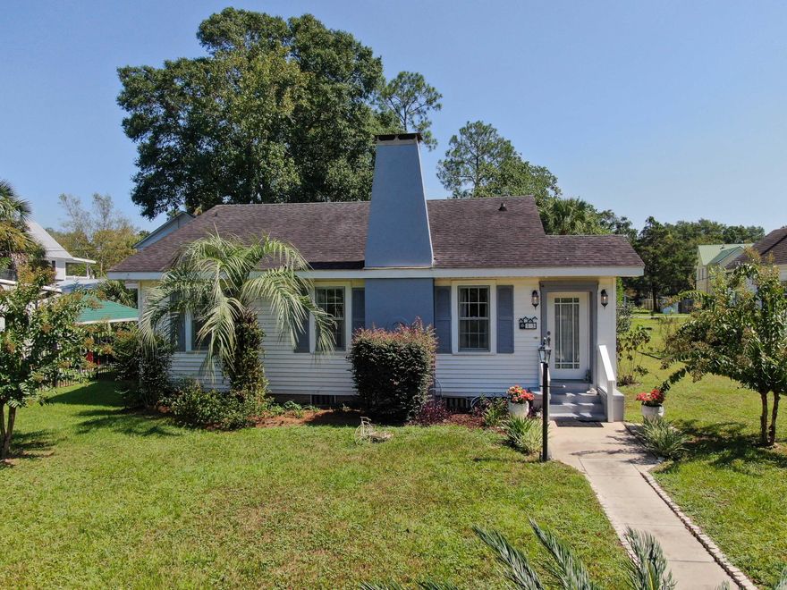A beautiful blend of original historic features complemented with tasteful updates creates the perfect combination for this rare opportunity to own this one-story cottage less than 2 blocks to Lake DeFuniak in historic downtown DeFuniak Springs. Upon entry, you will find tile and hardwood floors in excellent condition and throughout the entire home (no carpet!). The natural gas fireplace will keep you cozy and mess-free during the chilly north FL months. You'll enjoy the well appointed kitchen with painted creamy white cabinets, solid surface countertops and newer SS appliances. The layout is efficient and yet you'll find plenty of storage. The dining area is accented by painted wood walls adding to the overall charm. There are 2 master beds and 2 baths with the option of a 3rd bedroom in the separate spacious den, just off the kitchen. The first master suite features a spacious bathroom with a tub/shower combo. The second master suite offers room for a king size bed with a shower only in the master bath. The utility room just off the kitchen, offers extra storage for any kitchen or pantry overflow. Outside you'll discover so many treasures on this manageable 1/4 acre lot. First, is the cozy back deck, which leads to the detached 2 car carport. A favorite spot for relaxing is around the rock-lined firepit or under the gazebo. There are also 2 storage buildings/workshop areas for even more storage and working areas. This is a golden opportunity to own in one of the most charming southern towns you could find, so don't delay!