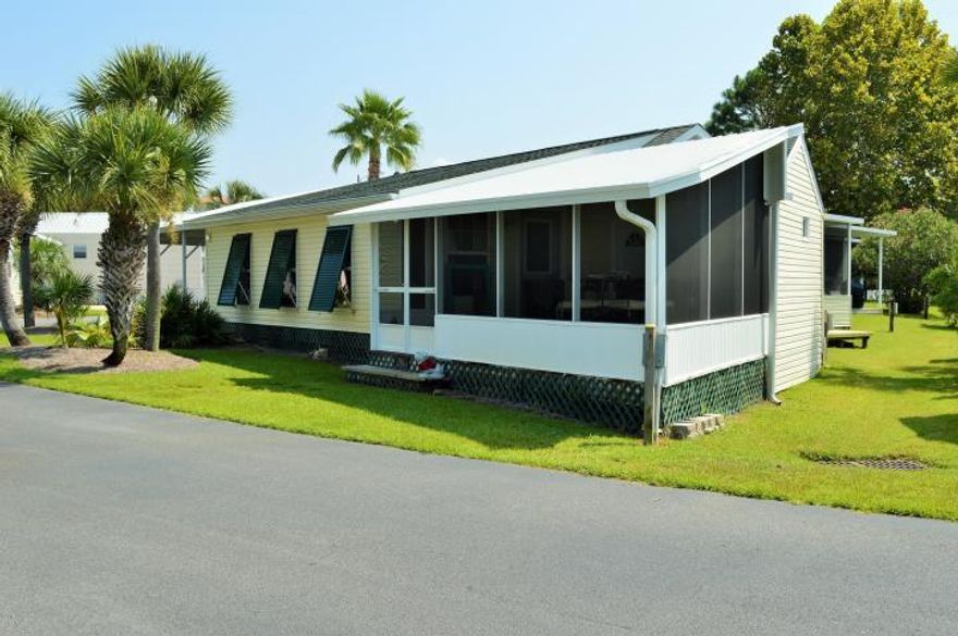 GREAT OPPORTUNITY in Emerald Pointe Resort! This could be your new home or short term rental investment property!! FULLY FURNISHED. Largest Lot in the community. Located near back swimming pool. 3 Bedrooms, 2 full baths, custom LED lighting in carport with covered parking for 4 cars, and screened in porch. Hardwood floors, semi custom cabinets, stainless appliances, and great living space both inside and outside! Emerald Pointe Resort is a gated community with 2 pools, hot tubs, playgrounds,and near all Panama City Beach has to offer. The HOA fee covers ALL but your power bill making life at the beach easy! GOLF CART INCLUDED!! This will not last long!