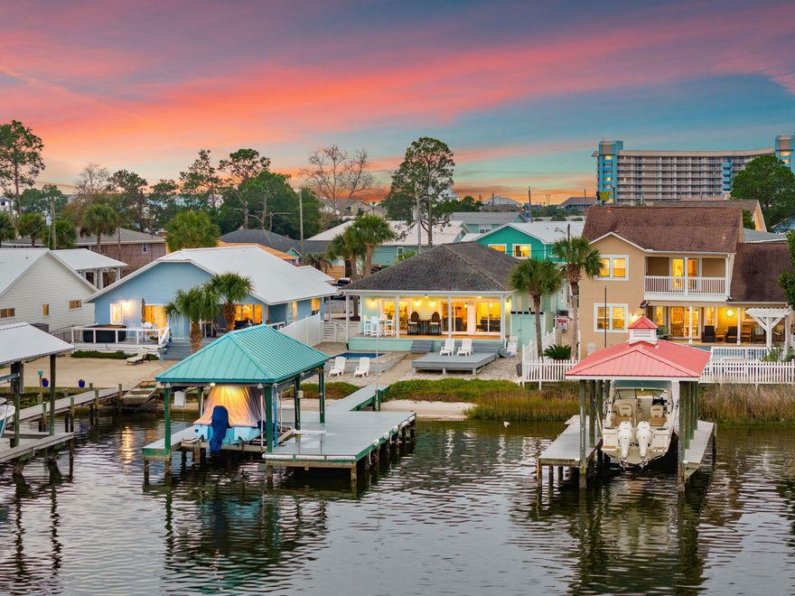 OPEN HOUSE -- Saturday (2/7) 10am-2pm.Discover your personal waterfront sanctuary on Grand Lagoon--a rare gem that blends effortless luxury with the serene rhythms of coastal life. This beautifully maintained 3-bedroom, 2-bathroom home offers 1,537 square feet of thoughtfully designed living space and panoramic lagoon views that will take your breath away. Step outside and discover a private paradise designed for both relaxation and recreation. From the paver-lined drive to the low-maintenance Bahama rock landscaping, every detail speaks to ease of ownership. The Trex decking flows seamlessly to a covered dock outfitted with a boat lift, inviting you to launch into St. Andrew Bay or head straight to the Gulf. A heated and cooled pool ensures year-round enjoymentideal for cooling off on warm afternoons or enjoying a quiet dip under the stars. 

Inside, the open-concept layout is bathed in natural light and oriented toward the water, framing postcard-perfect views at every turn. With furnishings negotiable, this turn-key retreat is ready for immediate enjoyment or prime for short-term rental income. 

Located just moments from the beach and surrounded by three convenient boat launches, it's the ideal home base for boaters, beachgoers, and dreamers alike. 

Whether you're seeking a permanent residence, a vacation hideaway, or a high-performing investment property, this Grand Lagoon gem checks every box. Waterfront opportunities like this are becoming exceedingly raredon't miss your chance to own a slice of paradise. 

Reach out today to schedule your private showing. All information and measurements are deemed reliable however not guaranteed. Buyer should confirm all information.