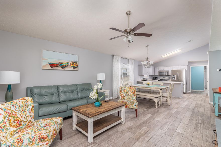 Located approximately 1.2 miles from Panama City Beach beach access 38, this turnkey, FURNISHED and updated house is ready to be added to your investment portfolio whether as a SHORT TERM RENTAL property, primary residence or a second home.  Rental history from AirBnb and projections are available.The house is backed up to the 2 community pools.  Hang out in the screen in porch area while having a bbq and enjoying a swim.  Warmer weather is here!This 3 bedrooms and 2 bath home is tastefully decorated with beach decor, wood like floor tile throughout and stainless steel appliances.The front bedroom offers queen sized bed with the middle bedroom having a double/twin bunk and a full/twin bunk.  The master bedroom has a queen sized bedroom.