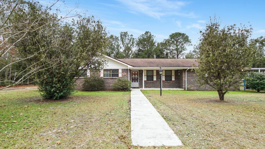 This 5 bedroom/3.5 bath brick home sits on 2 lots in a cul-de-sac across from Lake Rosemary. All bedrooms and bathrooms are on a single level, presenting a functional layout with plenty of space. The home is a solid structure with generous square footage provide a strong foundation for cosmetic updates and renovation. Seller states the approximate age of the roof is 7 years and HVAC is 3 years new. The second lot offers potential for future development, whether as a separate build site or an opportunity to sell. A rare combination of size, location, and investment potential in an established neighborhood. The spacious living room with impressive brick fireplace opens to the large back with several storage buildings. Located less than 10 minutes to downtown historic DeFuniak Springs, FL.