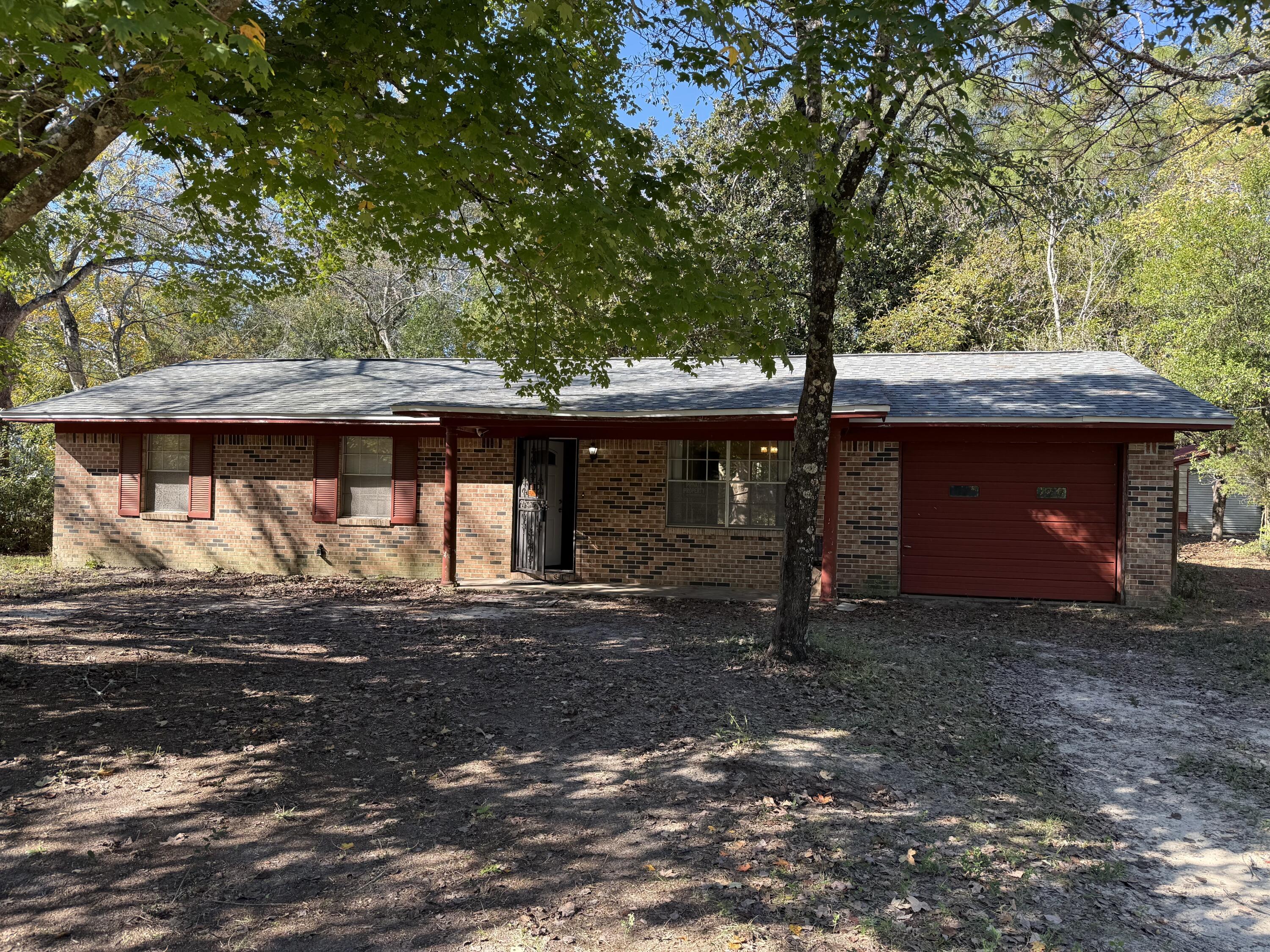 ''AS IS'' Sale! Super location south of I10 3/2 with attached garage plus double detached Garage/Shop on .99Acre flat corner lot! Rare find! Bring your ideas and dream this home into a winner! Cash or Conventional financing Only! New roof 2021 and new central AC 2023!Has aluminum wiring so tough to get insurance.