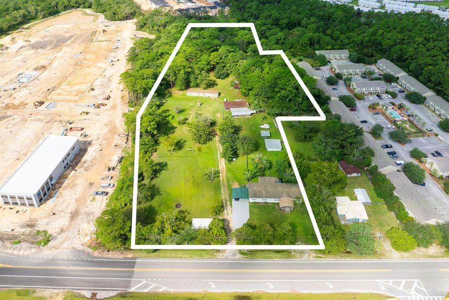 We are proud to offer this fantastic 5.39-acre development opportunity located in the heart of one of Florida's fastest growing cities. The city of Freeport - only 15 miles from the Gulf of Mexico - has worked diligently to keep the fast-paced growth compatible with the spirit of a small town. Zoned Residential / Commercial, the land uses are vast, with options ranging from apartment complexes to government buildings, hospitals, storage facilities, restaurants or retail! Presently, two properties have income-earning potential for your benefit. In addition, a usable woodworking shed and plenty of storage space convey. This 5.39-acre parcel comprises two lots, one 5.15 and the other .24 acres. This .24 acre parcel is being priced and sold with a larger 5.15 acre parcel MLS# 959174.